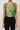 Green floral cropped top on model, studio