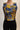 Navy mustard floral cropped top on model, studio