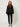 336594 Zip Blouse Black - front view on model, sheer black blouse with gold front zipper and balloon sleeves