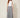 SR TL Edge Pants in grey tropical leaf print - model front view, flat front waistband and wide draped legs