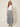 SR TL Edge Pants in grey tropical leaf print - model front view, flat front waistband and wide draped legs