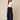 Navy blue abshar pants on model - front view with flat waistband, pleats and waterfall side drapes