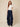 Navy blue abshar pants on model - front view with flat waistband, pleats and waterfall side drapes