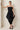 Black taffeta strapless overall - front, wide box pleats, sash tied at front