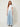 SR Light Blue Pants on model - front view with flat curved yoke waistband, piped seam and pleats