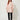 Pink Linen Bandi Coat on model - front view, fully closed gold zipper, chest flap pockets and small drawstring bows at the front waist