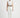 Gray Tina top - front studio view on Ziba with white trousers