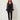 2354001 SILK DRESS TOP BLACK - front view on model, sheer organza open-front top worn open over a black camisole and slim pants