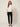 Nova Spring Blouse White on model - front view with flat pointed collar, closed front and sequin flower embellishment
