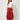 Red Edge Pant in red crinkle-textured fabric, front view on model, flat front waistband and draped asymmetric edge side panels