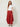 Red Edge Pant in red crinkle-textured fabric, front view on model, flat front waistband and draped asymmetric edge side panels
