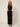 01333365 CHAIN CIRCLE BELT GOLD - front view on model, gold disc and ring chain belt over a black dress