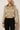 Kaira champagne-gold crinkle jacket - front, worn by Ziba
