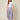 SR394 LILAC ABSHAR PANTS - front view on model, flat waistband with pleats and waterfall side drape panels