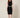 01333364 CHAIN CIRCLE BELT SILVER - front view on model, silver disc and ring chain belt at the waist over a black dress