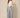 Grey chevron pleated wide-leg pants with front waist tie bow - model front