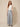 Grey chevron pleated wide-leg pants with front waist tie bow - model front