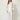 White sheer organza cover worn open over ivory camisole and white trousers - front