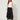 Black studded handkerchief-hem palazzo pants — model front view