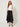 Black studded handkerchief-hem palazzo pants — model front view