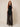 Black sheer organza palazzo pants on model, front view