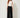 Black palazzo pants with sash tie and pleated panel - model front