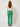 Green tailored trousers - back view on model