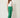 Green tailored trousers - three-quarter view on model
