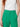 Green tailored trousers - waistband and button detail