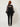Black sheer organza open-front cardigan with embroidered circle motifs - back view on model