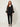 Black sheer organza open-front cardigan with embroidered circle motifs - front view on model