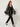 Black sheer organza open-front cardigan with embroidered circle motifs - side view on model