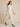 0134025210 model walking v2 - white sheer organza cropped jacket hem just below waist
