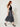 delsha black charcoal-grey satin midi skirt, walking view