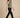 Sage green sleeveless cowl-neck top on model, side view