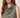 Sage green sleeveless cowl-neck top on model, cowl neckline detail