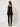 601570 BLACK FRINGE TOP - back view on model, plain back with centre seam, collar band fastened at the back of the neck, fringe hem