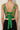 Green floral cropped top on model, studio