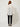 Straw Cover White on model - back view with the collar folded at the back neck, plain back and wide cuffed sleeves