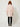 Pink Linen Bandi Coat on model - back view, plain back with gathered drawstring waist channel and wide cuffed sleeves