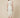 RM1528 white lady dress - back view on model, centre-back zipper, hook fastenings at the collar and vent at the back hem