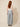 Grey chevron pleated wide-leg pants - model back with belt loops and elastic center back waist