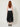Black studded handkerchief-hem palazzo pants — model back view