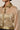 Kaira champagne-gold crinkle jacket - three-quarter detail, worn by Ziba