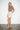 600910 Two Button Skirt Cream — model/02-threequarter.jpg