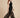 Black sheer organza palazzo pants on model, side view