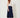 Navy wrap pleated skirt - side view with tie on model