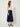 Navy wrap pleated skirt - side view with tie on model
