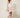 White cherry-blossom scallop-trim mini skirt - model three-quarter view