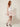 White cherry-blossom scallop-trim mini skirt - model three-quarter view